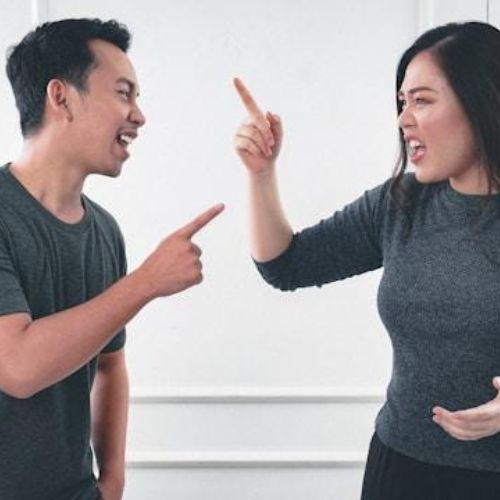 A man and a woman engaged in a heated argument