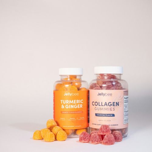 Two bottles of dietary supplements labeled "Turmeric & Ginger" and "Collagen Gummies" with gummies spilled in front, indicating health-focused products.