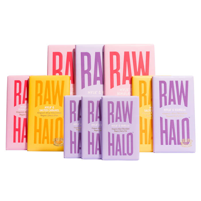 This image shows an assortment of Raw Halo organic chocolate bars, with various flavors such as "Mylk & Salted Caramel," "Mylk & Himalayan Salt," and "Mylk & Vanilla." The packaging is bright, with colors like lavender, orange, pink, and yellow, and large bold letters that say "RAW HALO." These bars are labeled as organic, vegan, and dairy-free.